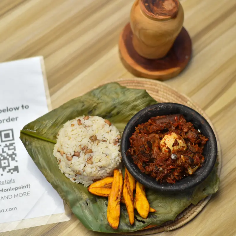 Rice and beans (cooked together) and ata dindin