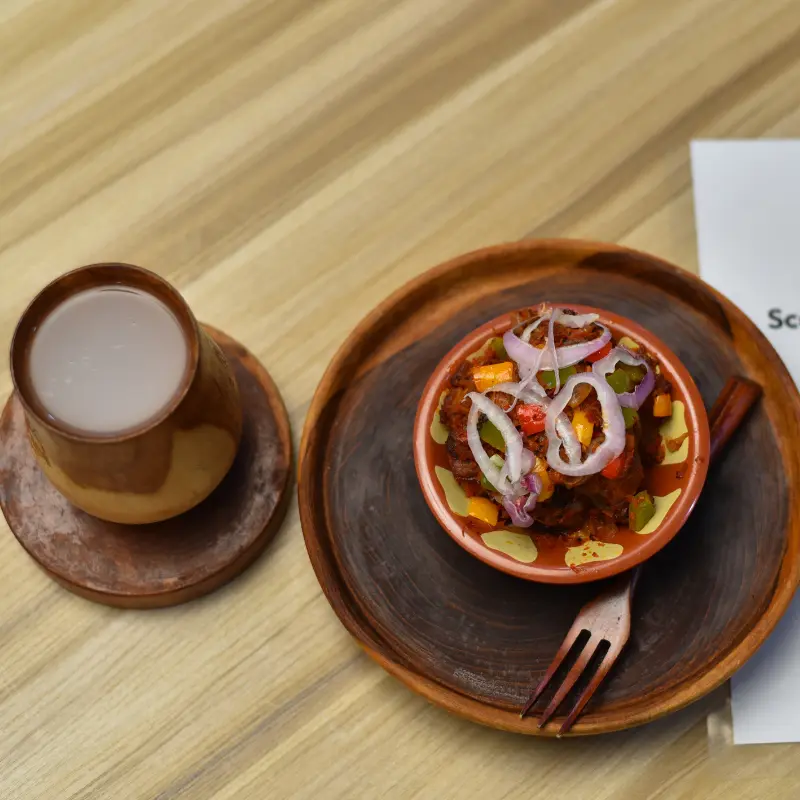 Peppered bushmeat and palmwine / watermelon juice